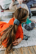 Load image into Gallery viewer, Hi! I'm MARILOU, a big light blue corduroy scrunchie.  It draws attention without stealing the spotlight, and ties itself up in many ways.