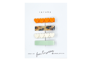 Hi! I'm a SET of&nbsp;4 smiley clips.

(1 x&nbsp;Marie&nbsp;heart, 1 x Lucy bar, 1 x Bonnie heart, 1 x&nbsp;Bregje&nbsp;bar)

Hold back bangs, clip back hair, or simply use for stylistic purposes by adding some flair to your hair. Mix-and-match, and layer these hair clips or wear on their own for a soft,&nbsp;seasonal look.