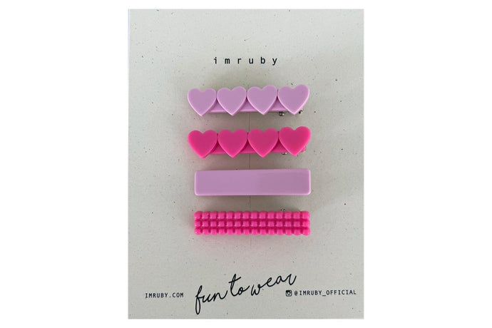 Hi! I'm a SET of 4 girly pink clips.  (1 x Elle heart, 1 x Barbie heart, 1 x Elle bar, 1 x Barbie bubble bar)  Hold back bangs, clip back hair, or simply use for stylistic purposes by adding some flair to your hair. Mix-and-match, and layer these hair clips or wear on their own for a soft, seasonal look.
