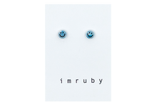 Load image into Gallery viewer, Hi! I&#39;m IZZY, a hippie blue smiley set of 2 stud earrings.

If you are looking for a perfect everyday staple, stud earrings may be exactly what you need!&nbsp;They are&nbsp;very tiny and so cute! These earring sets are perfect for numerous piercings or just to mix and match!&nbsp;

Packed&nbsp;in a reusable bag to keep your jewelry shiny and clean.