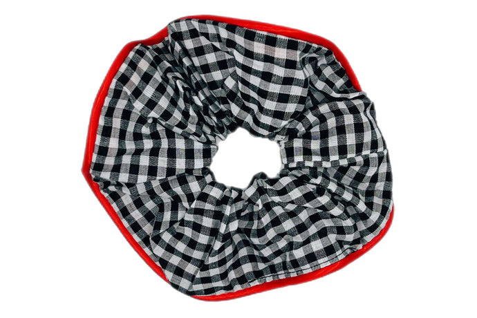 Hi! I'm KAIA, a plaid scrunchie with a red trim.

Messy hair? Not today. I’m soft, stylish, and gentle on your hair. Made from high-quality fabric with a classic plaid pattern — perfect for that effortless look with a touch of charm.