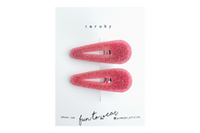 Load image into Gallery viewer, Hi! I&#39;m LEIA, a set of two pink glitter teardrop clips.

Sparkly, sweet, and always in the mood to shine. I hold your hair in place with just the right grip — no pulling, no slipping. Lightweight and shaped to stand out, even when you&#39;re keeping it casual. Clip me in and carry on.