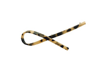 Load image into Gallery viewer, Hi! I&#39;m LUCY, a leopard printed barrette with a twist

Fierce, sleek, and shaped to stand out. My wavy silhouette adds a soft curve, while my bold leopard print brings just the right amount of wild. I’m lightweight, glossy, and made to stay in place — all day, any way. Just clip and go.
