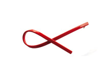 Load image into Gallery viewer, Hi! I&#39;m SUKI, a bold red barrette with a twist

Sleek, strong, and ready to snap into place. My gently curved shape adds a soft, sculptural touch to your look — whether you&#39;re going for effortless chic or pulled-back polish. Lightweight, glossy, and made to stay put. Just clip and go.