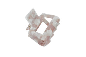 Hi! I'm YVONNE, a soft pink hair claw.  This hair claw lets you pull your hair up or back with ease and style! The square-shaped cutout design is the right fit for any occassion. 