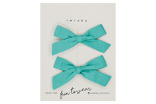 Load image into Gallery viewer, Hi! I&#39;m RUBY, a jade green mini bows set.  You&#39;ll fall in love with our cute clips that actually stay put, unlike your busy kid. This schoolgirl set features alligator clip backings for easy placement in any fun hairstyle.