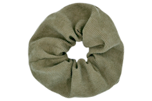 Load image into Gallery viewer, Hi! I&#39;m DONNA, a big green corduroy scrunchie.  It draws attention without stealing the spotlight, and ties itself up in many ways.
