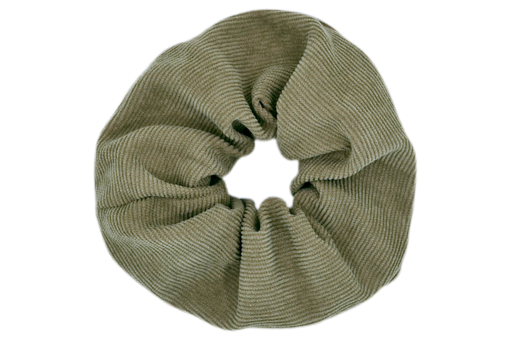 Hi! I'm DONNA, a big green corduroy scrunchie.  It draws attention without stealing the spotlight, and ties itself up in many ways.