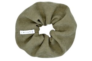 Hi! I'm DONNA, a big green corduroy scrunchie.  It draws attention without stealing the spotlight, and ties itself up in many ways.