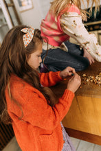 Afbeelding in Gallery-weergave laden, Hi! I&#39;m JAGGER, an orange flower headband.  This headband has an aluminium wire insert for a comfortable &amp; cute fit. Twist it around your girls head and she&#39;ll rock this pretty headband all day long!  This headband is the perfect fit for girls till 12 years.