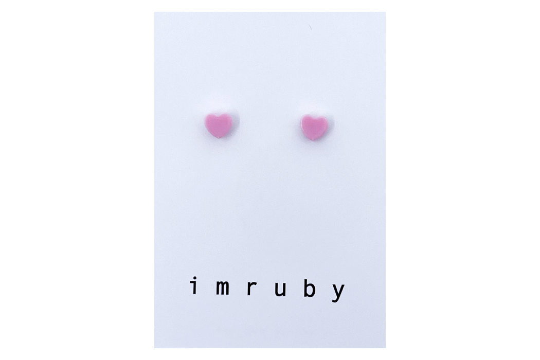 Hi! I'm ELLE, a soft pink heart set of 2 stud earrings.  If you are looking for a perfect everyday staple, stud earrings may be exactly what you need! They are very tiny and so cute! These earring sets are perfect for numerous piercings or just to mix and match! 