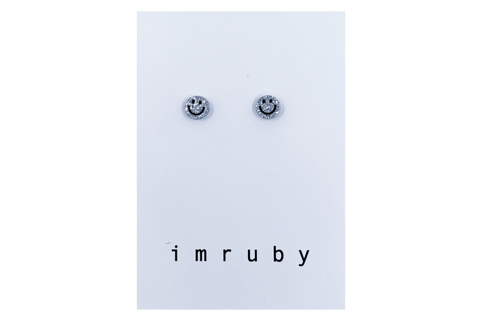 Hi! I'm BIBI, a silver glitter smiley set of 2 stud earrings.  If you are looking for a perfect everyday staple, stud earrings may be exactly what you need! They are very tiny and so cute! These earring sets are perfect for numerous piercings or just to mix and match! 