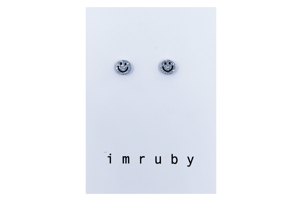 Hi! I'm BIBI, a silver glitter smiley set of 2 stud earrings.  If you are looking for a perfect everyday staple, stud earrings may be exactly what you need! They are very tiny and so cute! These earring sets are perfect for numerous piercings or just to mix and match! 