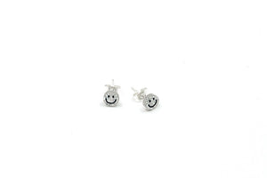 Hi! I'm BIBI, a silver glitter smiley set of 2 stud earrings.  If you are looking for a perfect everyday staple, stud earrings may be exactly what you need! They are very tiny and so cute! These earring sets are perfect for numerous piercings or just to mix and match! 