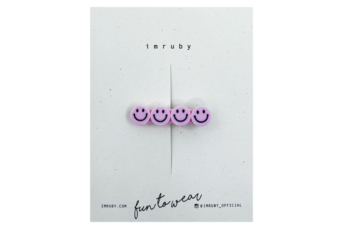 Hi! I'm ELLE, a soft pink smiley clip.  Hold back bangs, clip back hair, or simply use for stylistic purposes by adding some flair to your hair. Mix-and-match, and layer these hair clips or wear on their own for a soft, seasonal look.