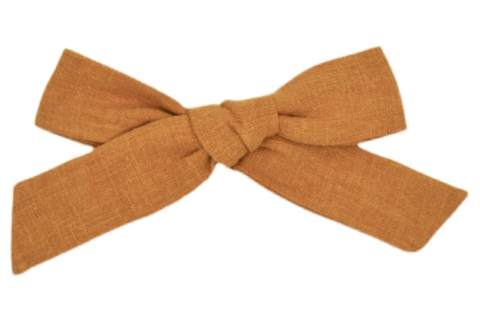 Hi! I'm LENA, a brown large bow clip.  Clip your hair back with the prettiest hair bow ever! This linen bow features an alligator clip for easy placement in any fun hairstyle.