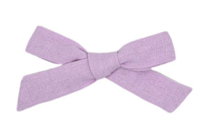 Hi! I'm LILI, a pink medium bow clip.  Add this charming bow to your hair to add some style and colour. This linen bow features an alligator clip for easy placement in any fun hairstyle.