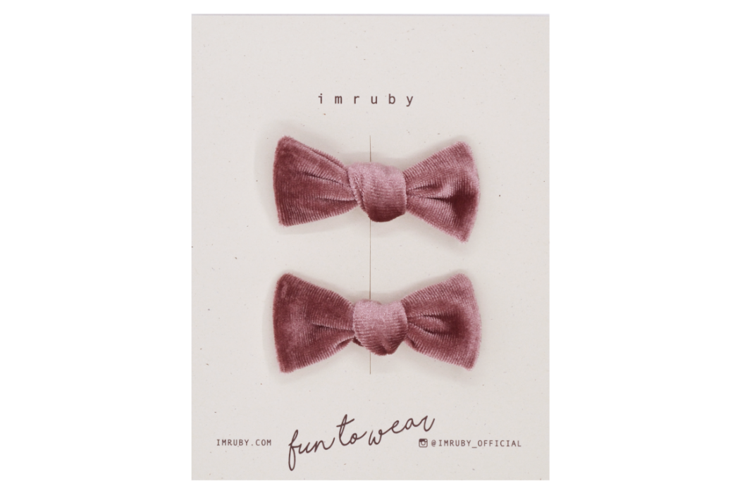 Hi! I'm MILLE, a set of pink velvet candy bows.  Clip those little hairs back in style with this set of velvet candy bows. It features alligator clip backings for easy placement in any fun hairstyle. 