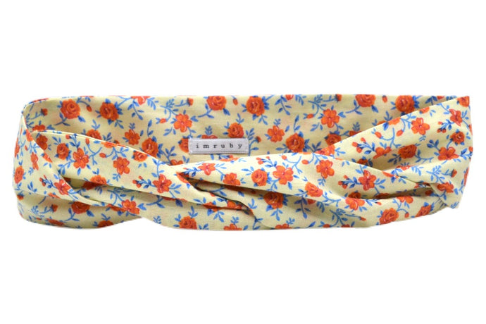 Hi! I'm JAGGER, an orange flower headband.  This headband has an aluminium wire insert for a comfortable & cute fit. Twist it around your girls head and she'll rock this pretty headband all day long!