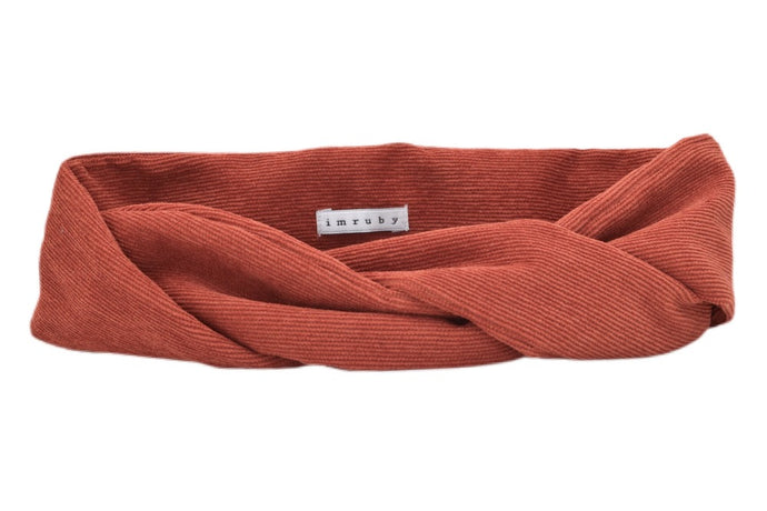 Hi! I'm SADE, an orange corduroy headband.  This headband has an aluminium wire insert for a comfortable & cute fit. Twist it around your head and rock this pretty headband all day long!  Click here to see how you can wear your headband.
