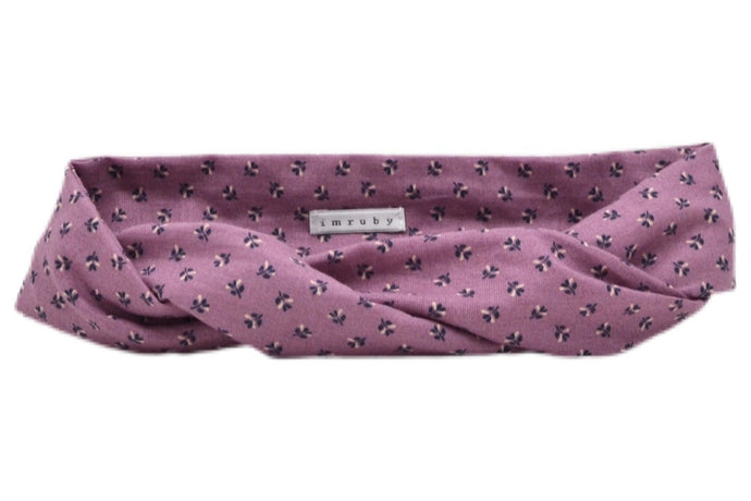 Hi! I'm DITA, a pink flower headband.  This headband has an aluminium wire insert for a comfortable & cute fit. Twist it around your girls head and she'll rock this pretty headband all day long!