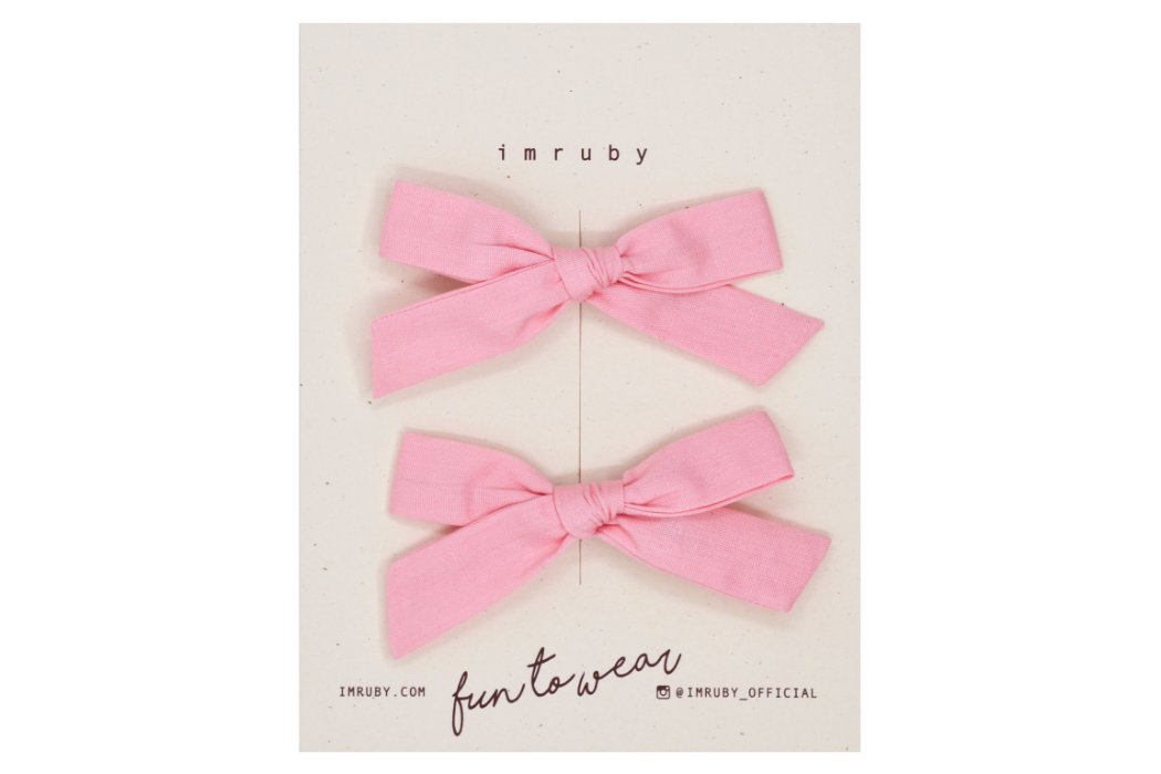 Hi! I'm CLEO, a nude pink petite schoolgirl set.  You'll fall in love with our cute clips that actually stay put, unlike your busy kid. This schoolgirl set features alligator clip backings for easy placement in any fun hairstyle.