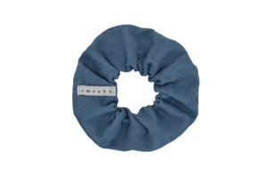 Hi! I'm JACKIE, an darker blue corduroy scrunchie.  Throwback your style to the 90's with this hair scrunchie! Perfect for wearing in your hair or styling it around your wrist, this pretty scrunchie is the ultimate two-in-one accessory.
