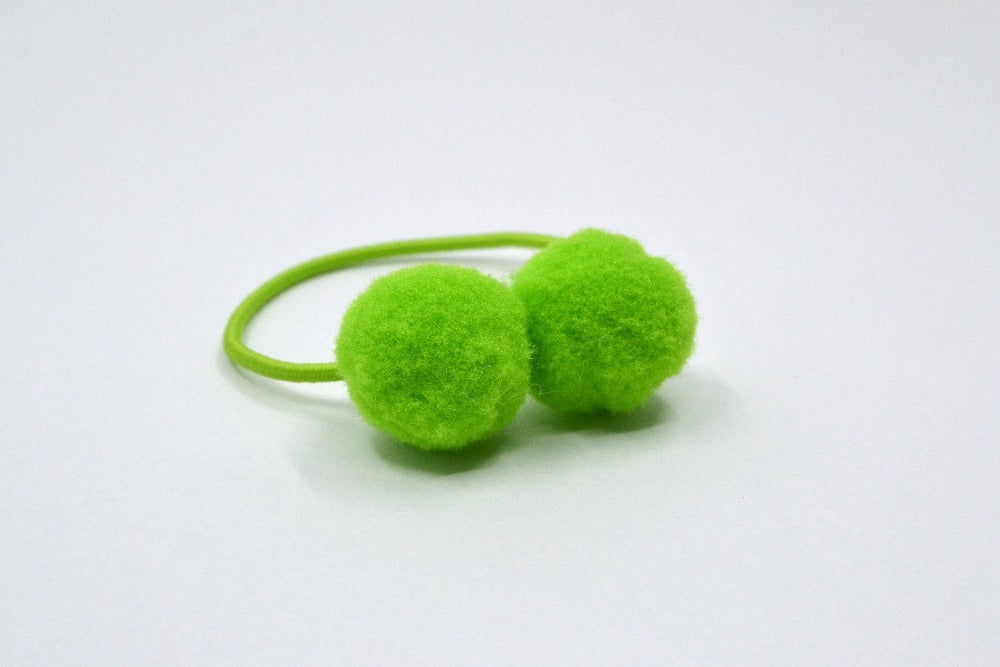 Hi! I'm LIZZY, a lime green elastic hair ties set.  Be on trend with this set of pom hair ties! This 2 pack of hair ties comes in lime green. 
